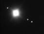 � Christoph Lohuis; Jupiter mit Ganymed, Io und Europa, 15. November 2000, 400 mm Newton f/5, 1 Sekunde, AGFA XRG 100, Ort: Neuenhaus